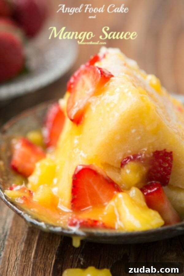 Sunshine Mango Cloud 4 Angel Food Cake with Mango Sauce - A light and fluffy cake paired with a vibrant, sweet mango sauce for a delightful dessert.