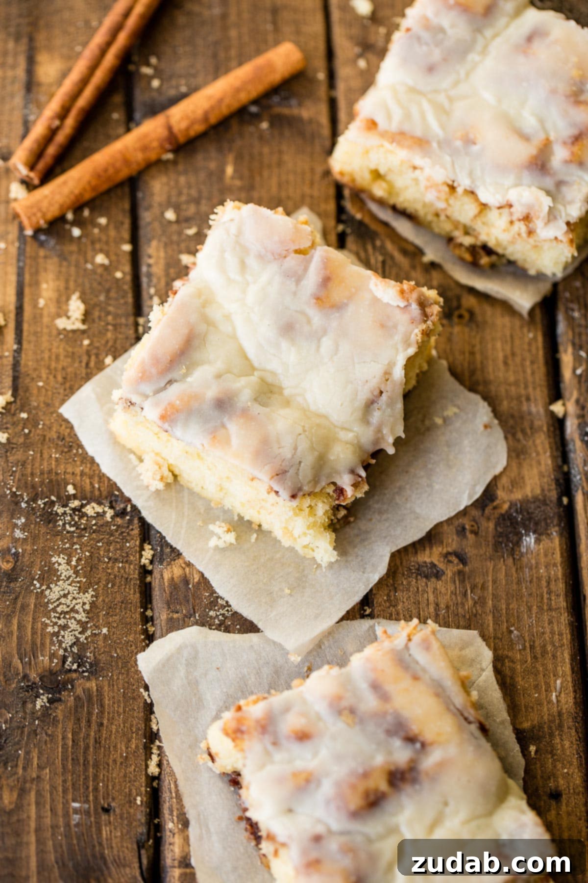 Cinnabon-Style Cinnamon Roll Sheet Cake 4 Closeup of the Cinnabon Cinnamon Roll Sheet Cake's moist interior, showcasing the delightful cinnamon swirls.