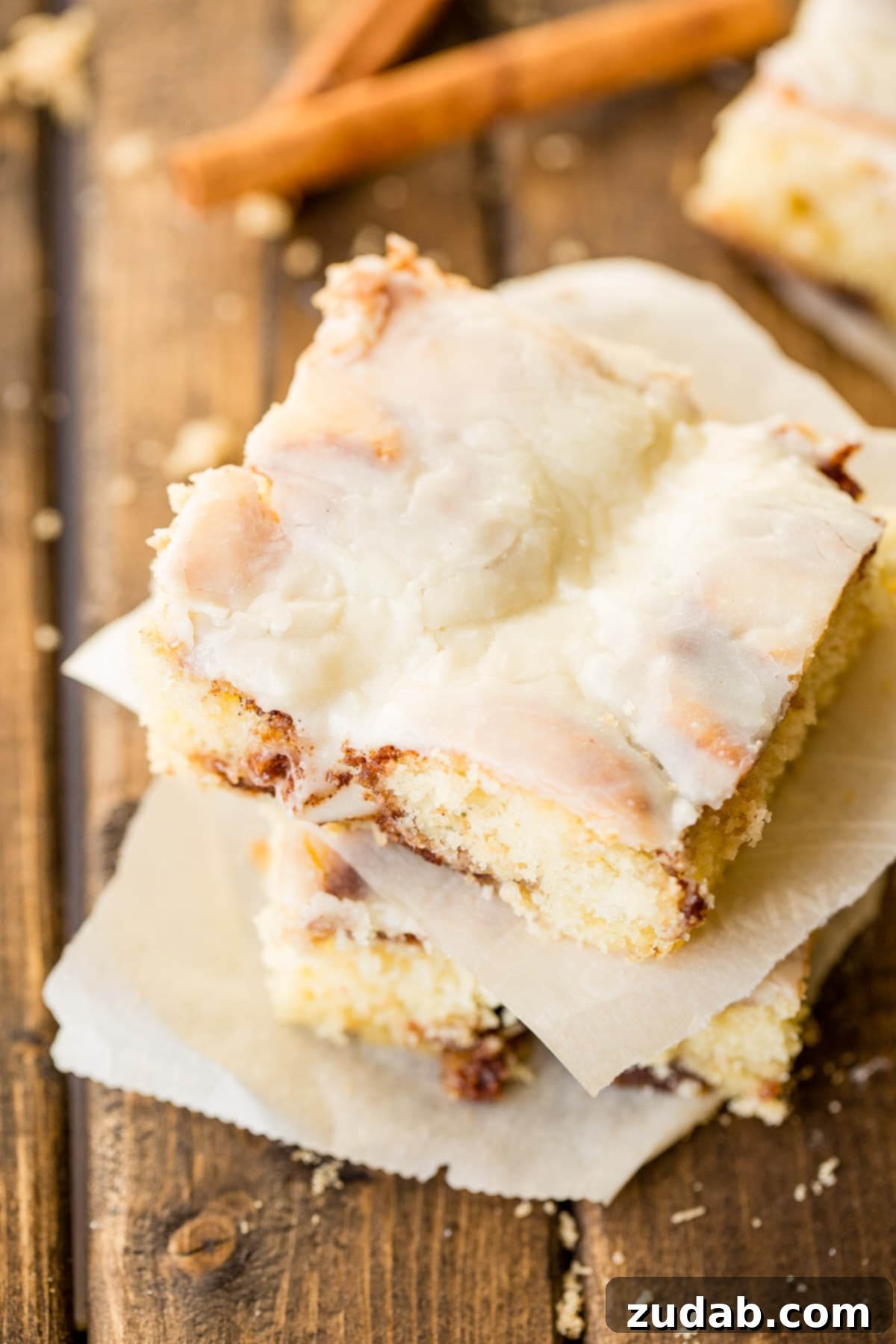 Cinnabon-Style Cinnamon Roll Sheet Cake 6 Close-up of the smooth and creamy Cooked Vanilla Cream Cheese Frosting on the Cinnabon Cinnamon Roll Sheet Cake.