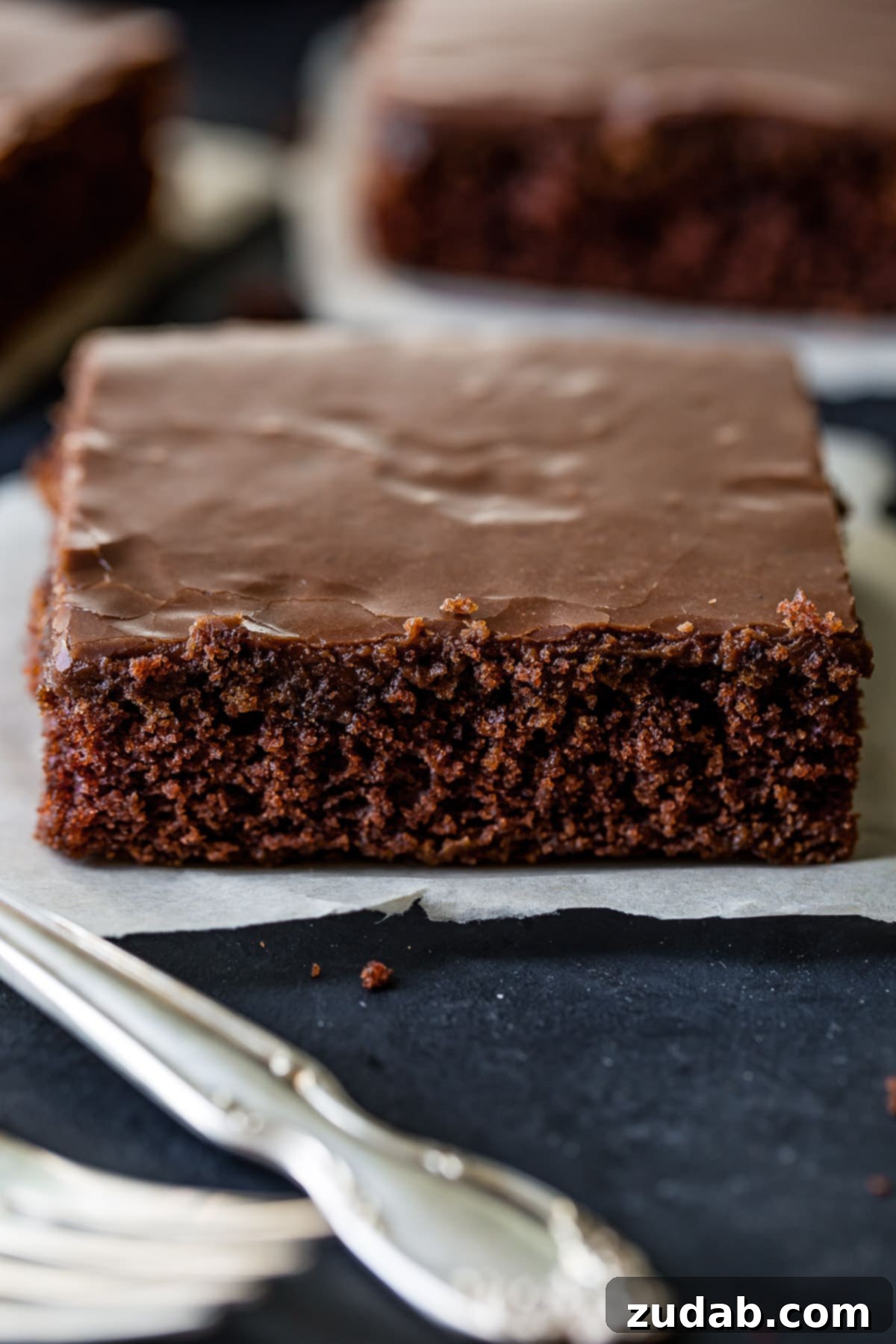 Cinnabon-Style Cinnamon Roll Sheet Cake 9 Mom's classic chocolate sheet cake recipe, featuring a moist chocolate cake and a luscious cooked chocolate frosting, a nostalgic family favorite.