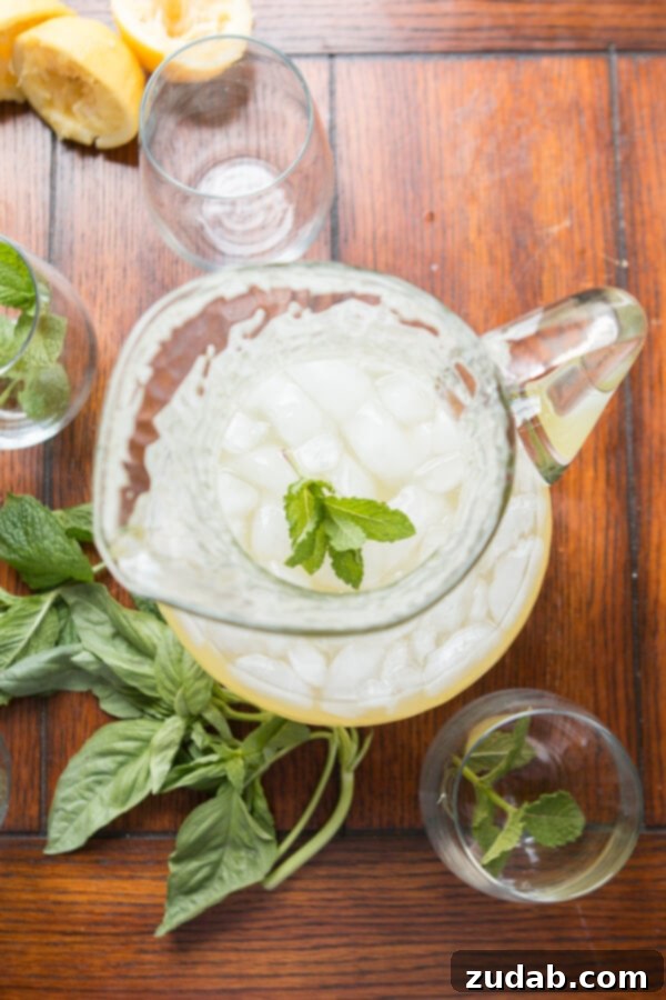 Fresh Herbs for Basil Mint Lemonade Close-up of fresh basil and mint leaves used in the Basil Mint Lemonade recipe, highlighting the key ingredients.