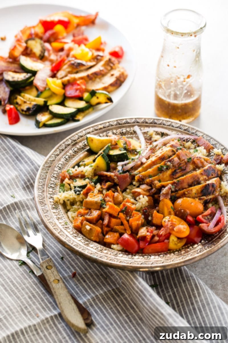 A perfectly assembled Honey Mustard Chicken, Spinach, and Artichoke Rice Bowl, showcasing its healthy and quick appeal for using up holiday leftovers.