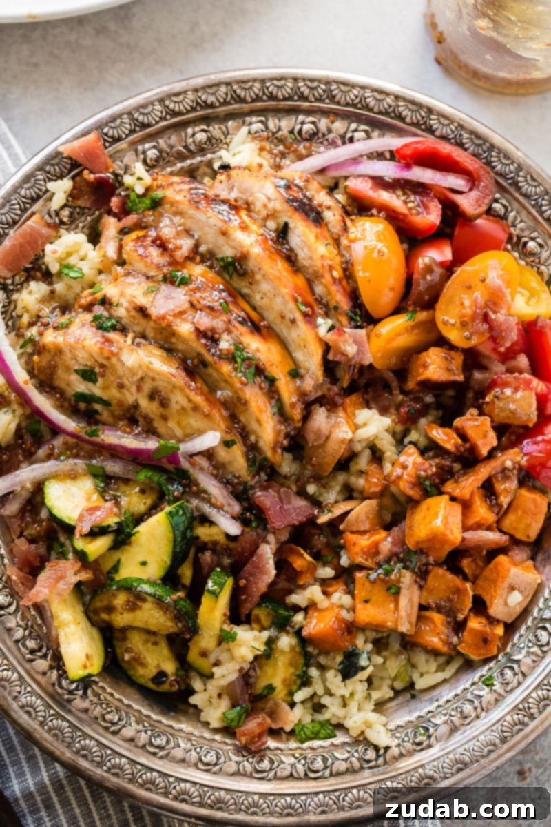 A vibrant and satisfying Honey Mustard Chicken, Spinach, and Artichoke Rice Bowl, perfect for quick, healthy meals and leftover makeovers.