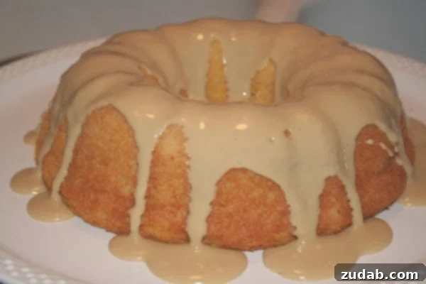 Heavenly Pumpkin Cloud Cake 2 Delicious Pumpkin Angel Food Cake with Maple Glaze on a white plate