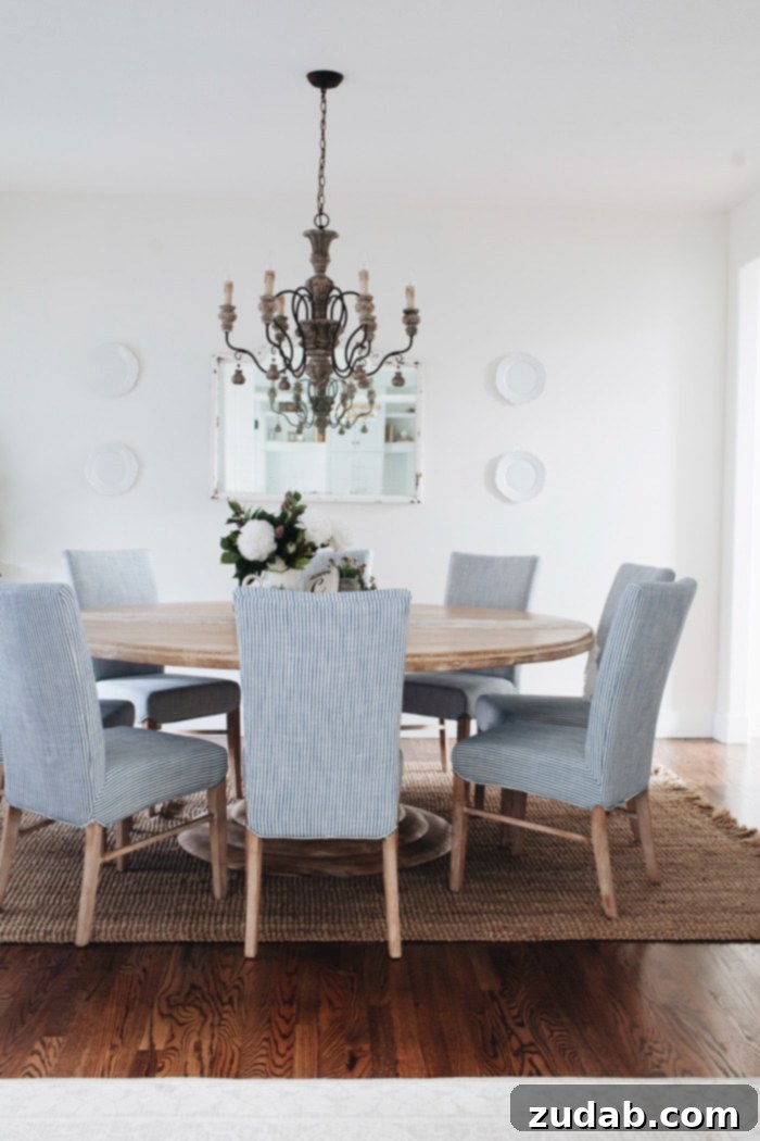 Natural weave fiber Maui Chunky Loop rug from RugsUSA, adding texture and warmth to the French Country dining room.