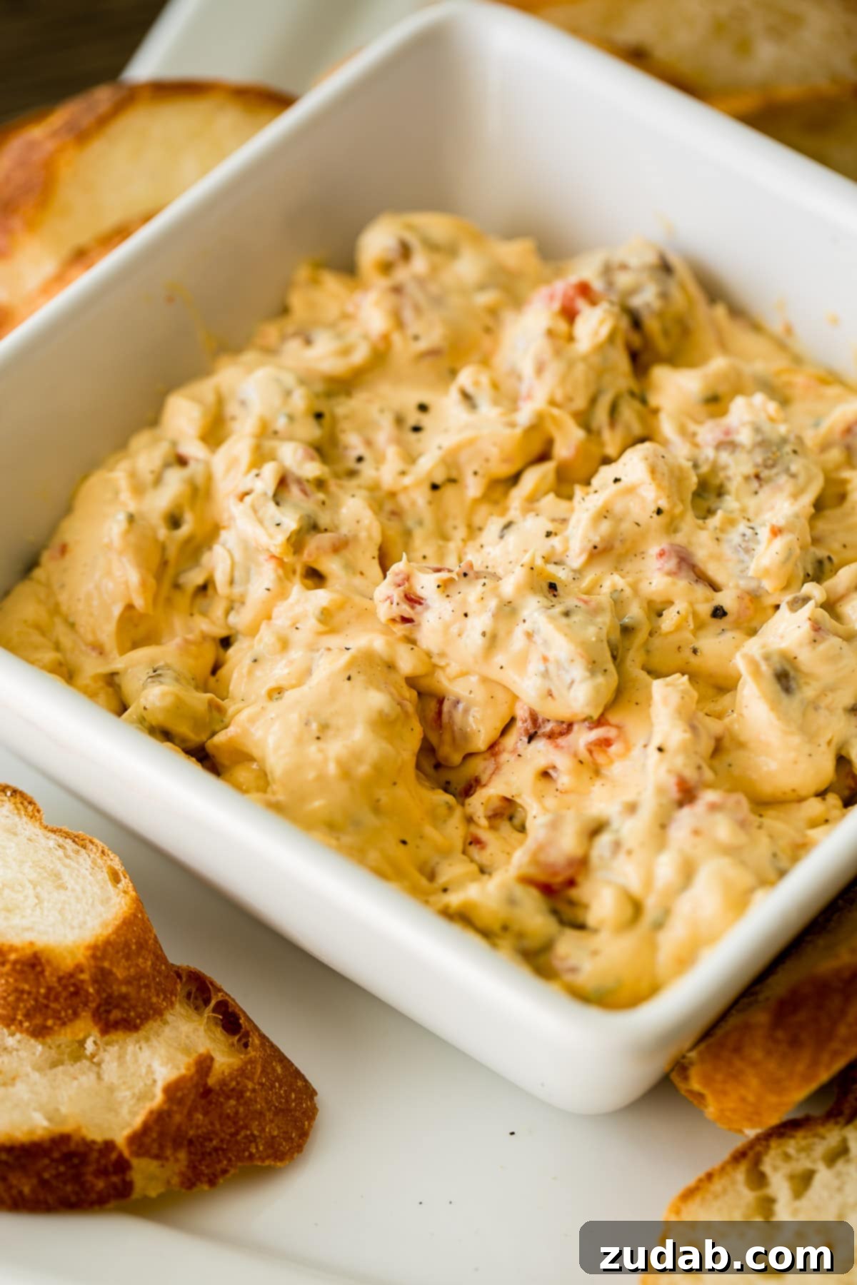 Creamy Cheesy Crockpot Sausage Dip 5 Throw tomatoes, ranch dip, cheese, cream cheese and sausage in a slow cooker and you've got cheesy slow cooker sausage dip! ohsweetbasil.com