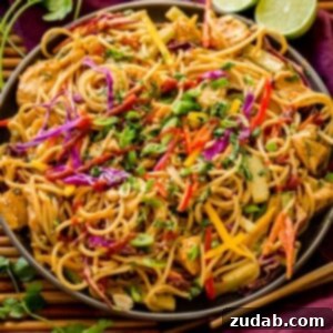 Thai Peanut Chicken Noodles 7 A bowl of delicious Thai Peanut Noodles with Chicken, garnished with peanuts and cilantro.