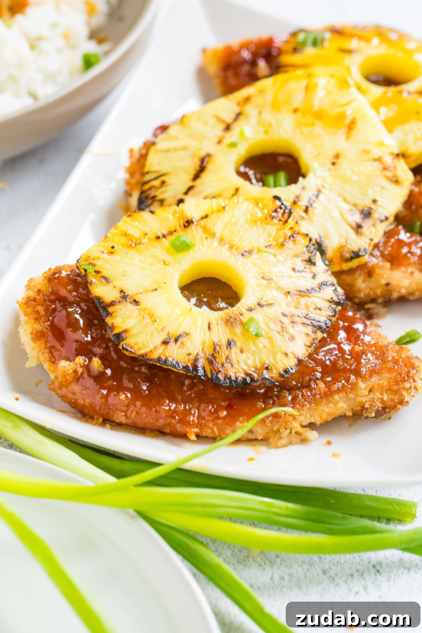 Speedy Sweet & Sour Pineapple Chicken 3 Breaded chicken with sticky sweet and sour sauce, topped with grilled pineapple and served over rice