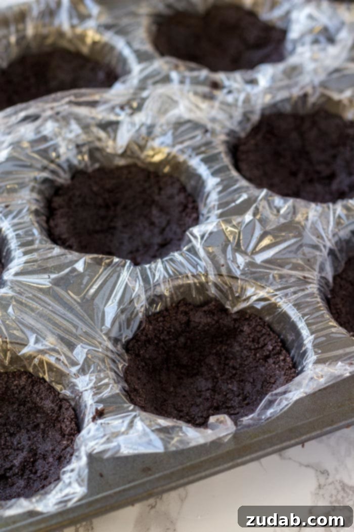 Dreamy No-Bake Chocolate Cheesecake Bites 4 Muffin tin with an Oreo cookie crust