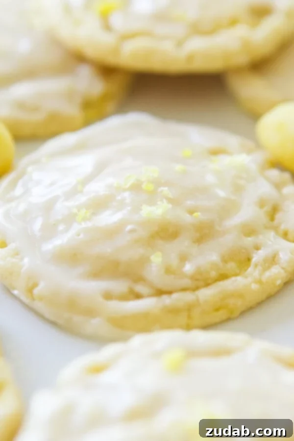 Irresistibly Soft and Chewy Lemon Drop Cookies with Glaze Soft and chewy lemon drop cookies with a light glaze and crushed lemon drops on top.