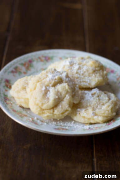 Zesty Lemon Drop Cookies 4 Soft, pillowy lemon cookies made with Doterra essential oils for a natural lemon flavor, from ohsweetbasil.com.