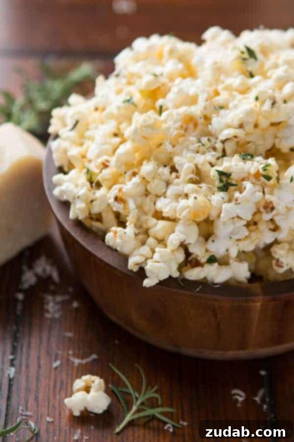Tangy Salt and Vinegar Popcorn 10 A bowl of Rosemary Parmesan Popcorn, a savory alternative to Marshmallow Popcorn. ohsweetbasil.com