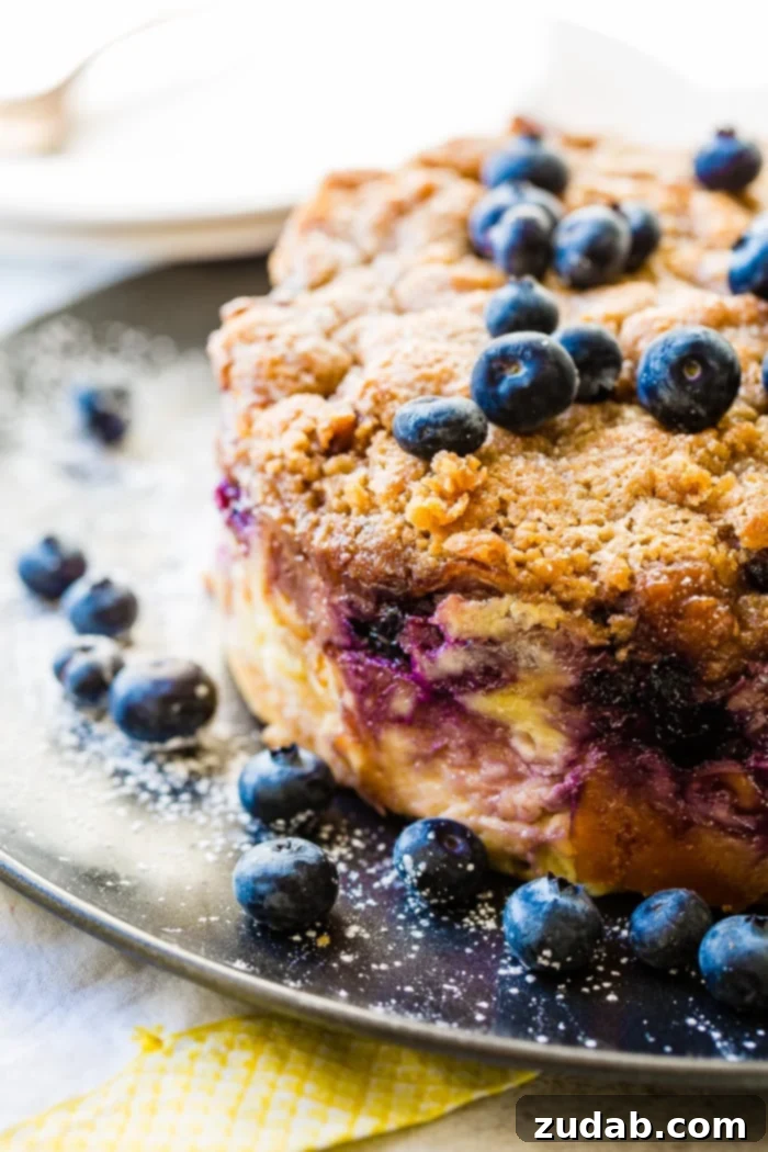 3 Irresistible Instant Pot Blueberry French Toast Bakes 3 A whole Blueberry French Toast Bake or French toast casserole, generously sprinkled with powdered sugar, ready to be served for a delightful breakfast or brunch.