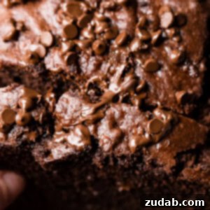 Ultimate Double Chocolate Banana Bread 6 A delicious slice of double chocolate banana bread, topped with a generous sprinkle of mini chocolate chips