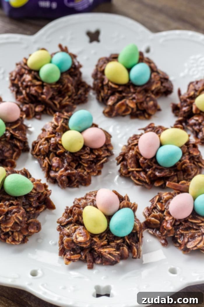 Hoppy Easter Nest Treats 4 A plate of Easter Nest Cookies topped with mini chocolate eggs, showcasing their delightful appearance and rich chocolate. Perfect for Easter.