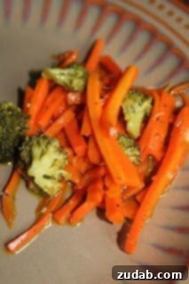 No-Fuss Veggie Side 2 A colorful medley of cooked vegetables, lightly seasoned, in a pan, ready to serve as a simple side dish.
