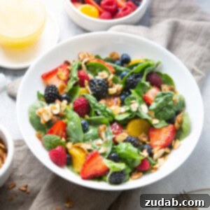 A photo of a finished Spinach Berry Salad with Lemon Dressing, ready to be served, showcasing its fresh and appetizing appearance.