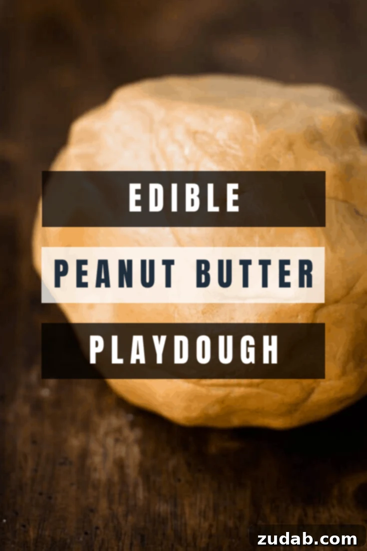 Whip Up Edible Peanut Butter Playdough Fun 3 A perfectly formed ball of delicious edible peanut buttter playdough, smooth and ready for play on a wooden surface.