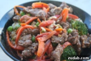 Ultimate Korean BBQ Beef 2 Delicious Korean BBQ Beef with colorful vegetables and rice