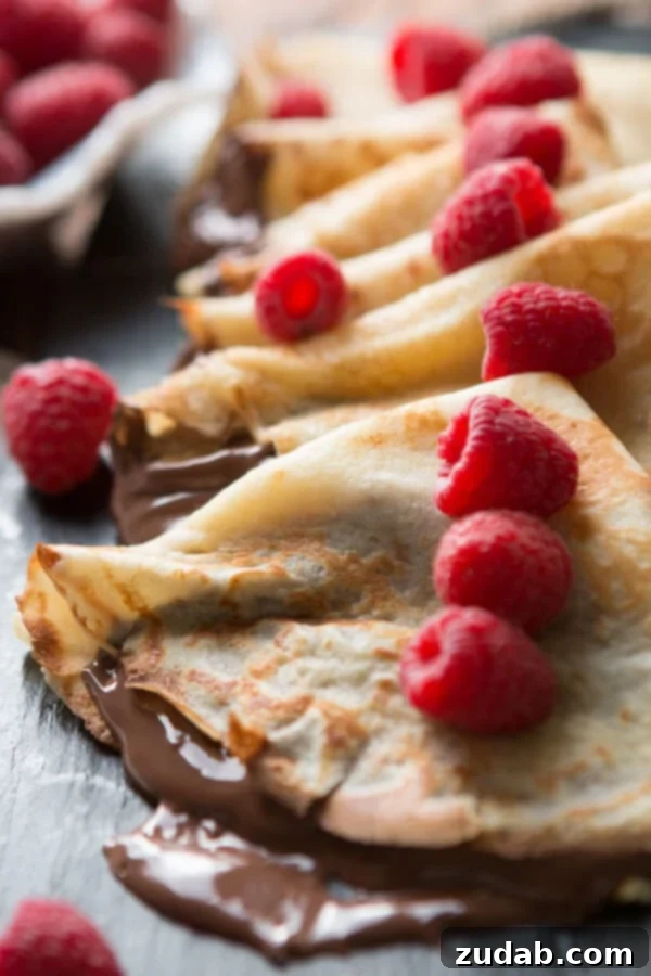 Delicious Nutella Crepes with fresh berries, a perfect French breakfast or dessert