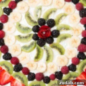 Fruit pizza with a soft sugar cookie crust ohsweetbasil.com