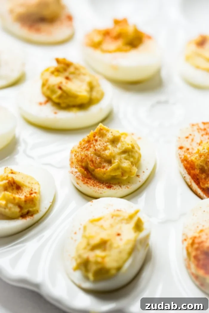 Perfect Deviled Eggs 3 A white deviled eggs platter with the best deviled eggs ever