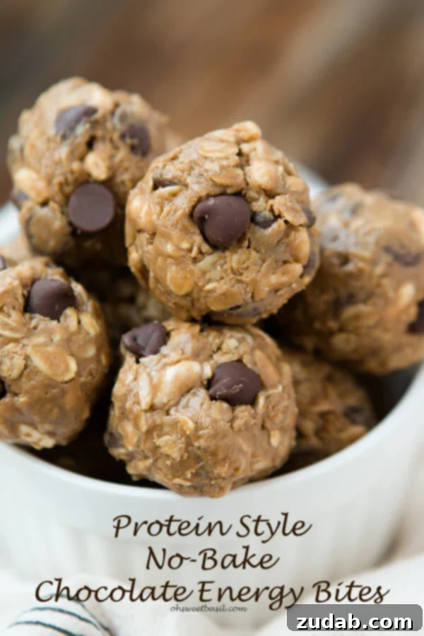 No Bake Smores Protein Power Bites 10 A stack of Protein No Bake Chocolate Energy Bites, positioned as the best healthy snack, resembling delectable cookie dough. This image promotes a wholesome and irresistible treat from ohsweetbasil.com.