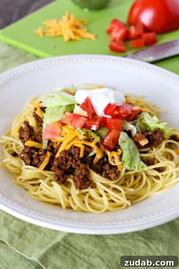 Simple & Satisfying Beef Ragu Pasta 12 A plate of Taco Spaghetti, combining the flavors of tacos with pasta, for a unique and easy weeknight meal.