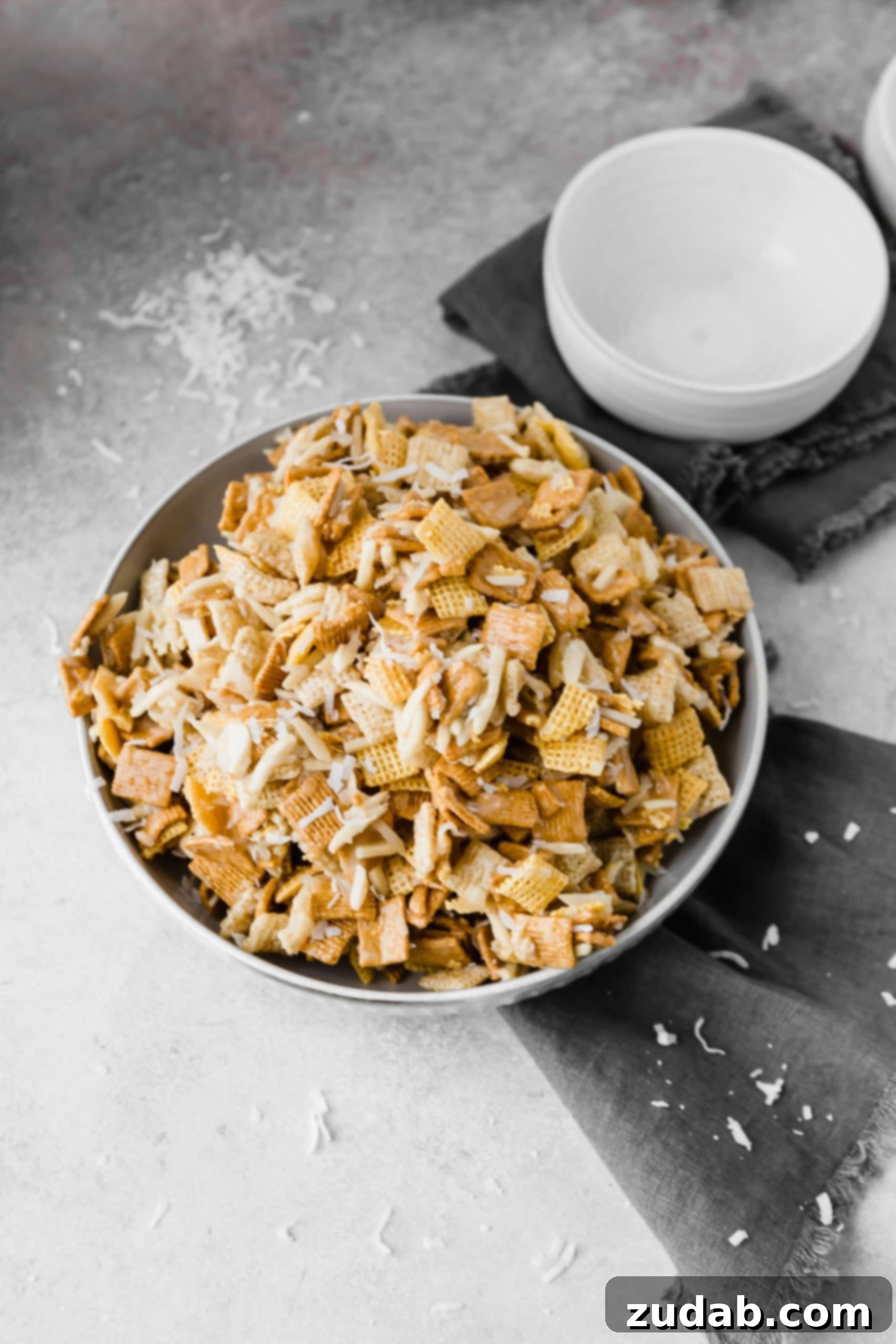 Coconut Sweet Chex Mix A picture of a large bowl filled with coconut sweet chex mix.
