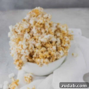 Sweet Caramel Crunch 2 A top-down view of caramel popcorn in a bowl, with a smaller image featuring an image for pinning.