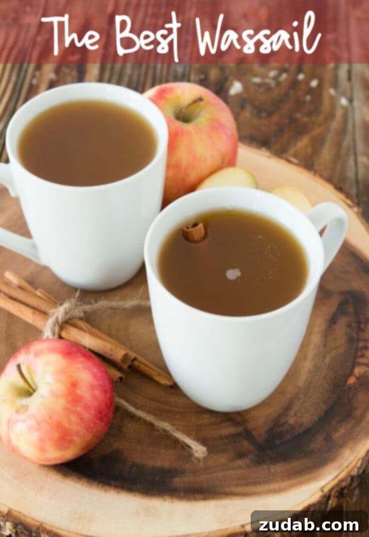 Warm wassail in a clear mug, perfect for soothing a sore throat