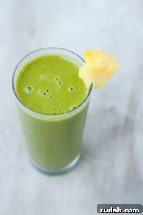 Green smoothie with fruits and vegetables, designed to boost immunity and fight colds