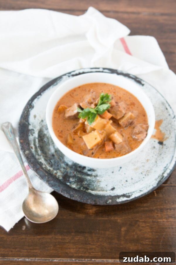 Comforting Slow Cooker Beef Stew Mom's Slow Cooker Stew Garnished with Fresh Parsley, Ready to Serve