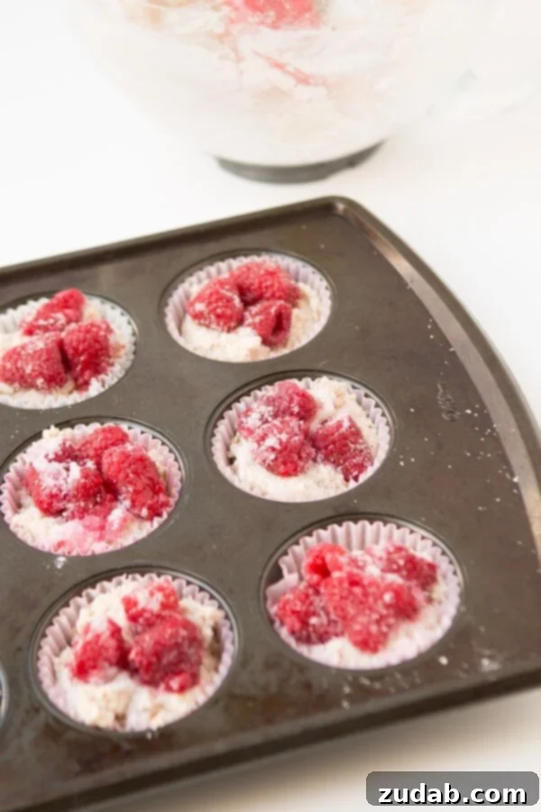 Irresistible Raspberry Cream Cheese Muffins Perfect for Breakfast or Brunch Delicious Raspberry Cream Cheese Muffins with Orange Zest