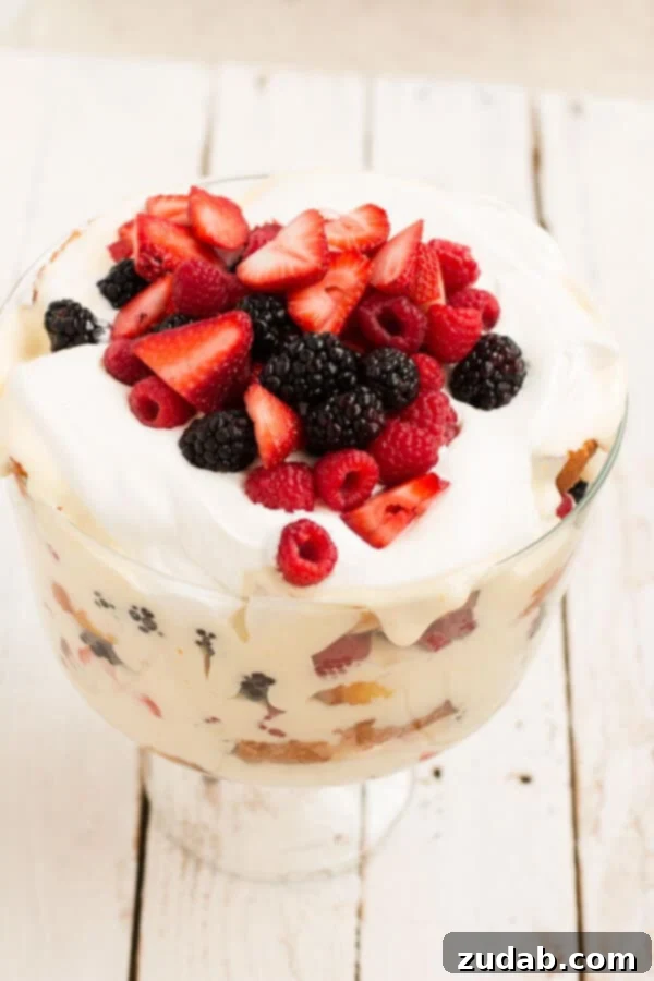 An irresistible Lemon Curd Berry Trifle, a favorite dessert for any occasion Lush layers of Lemon Curd Berry Trifle with abundant fresh berries