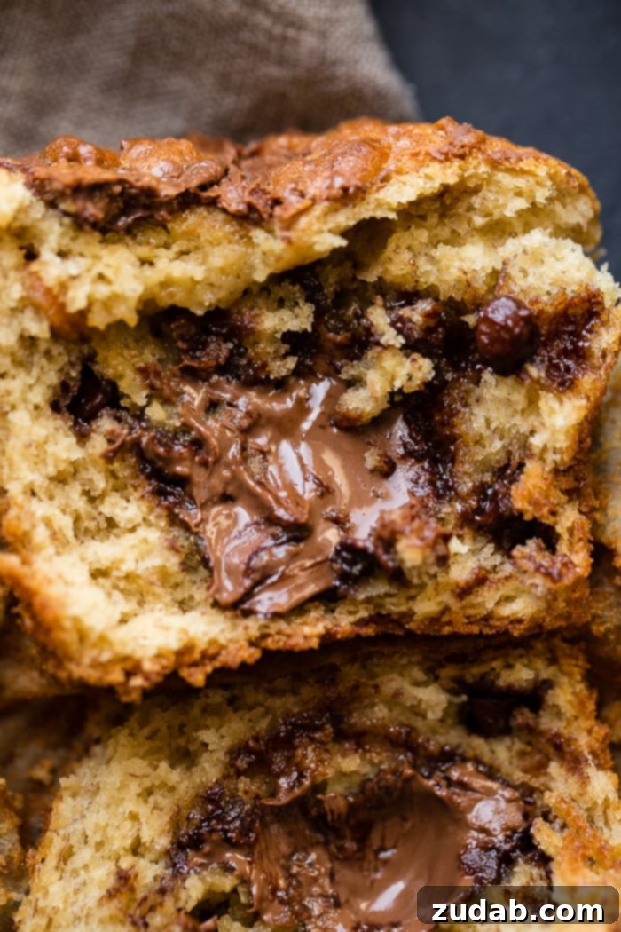 Peanut Butter Banana Muffins with a Gooey Nutella Center 2 Irresistible peanut butter banana muffins loaded with chocolate chips, peanut butter chips, stuffed with Nutella, and crowned with a Nutella swirl.