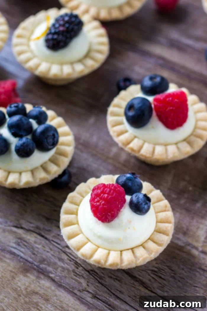 Petite Fruit Tartlets 4 Mini fruit tarts with fresh berries and sweet vanilla filling.