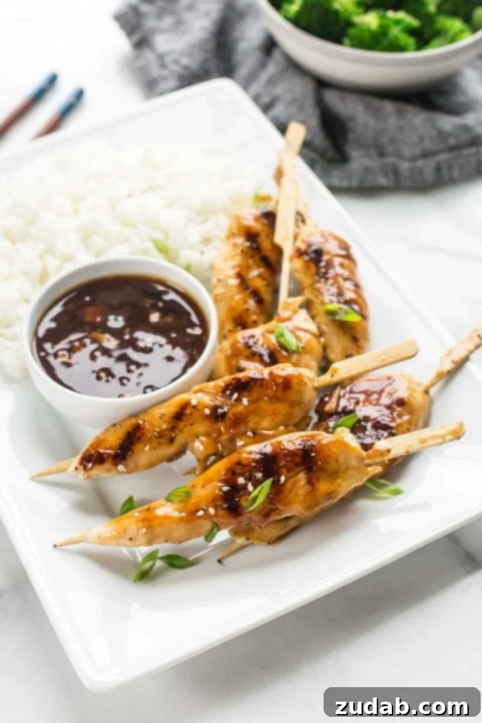 Sticky Honey Garlic Chicken Skewers 3 Close-up of Asian Chicken Skewers coated in honey garlic sauce