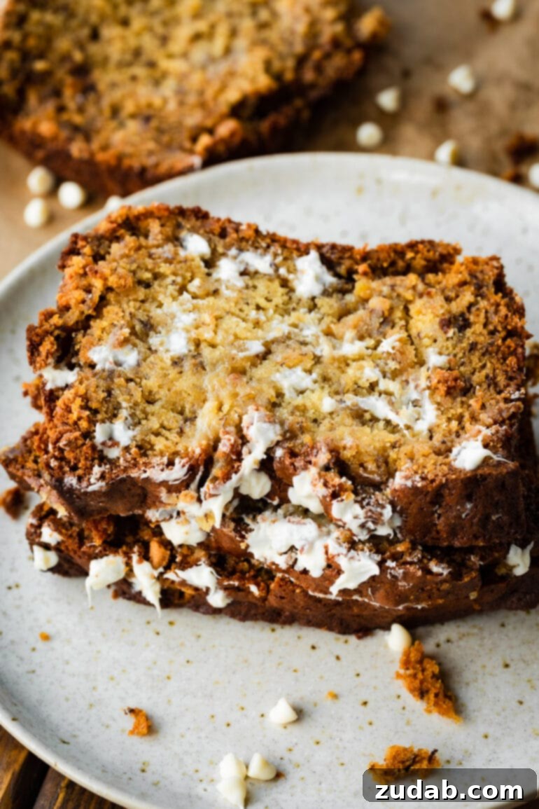 Moist White Chocolate Banana Bread 5 A slice of banana bread loaded with white chocolate chips!