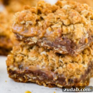 A stack of carmelitas with chocolate, caramel and an oat crumble