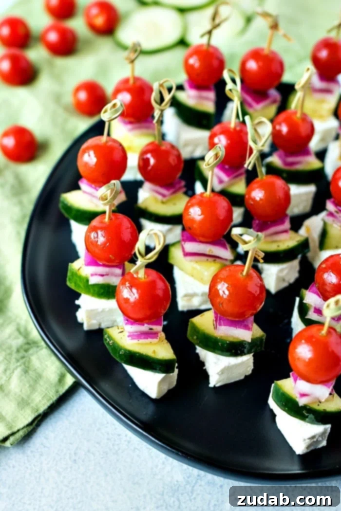 Mediterranean Mezze Skewers 5 A platter of beautifully arranged Simple Greek Salad Skewers, ready for guests to enjoy at a summer party or gathering.