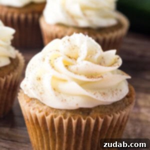 Cream Cheese Frosted Zucchini Delights 6 Zucchini cupcakes with cream cheese frosting are super moist with a delicious spice cake flavor and fluffy cream cheese buttercream.