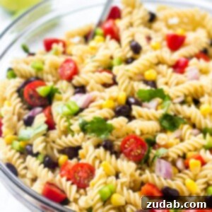 A bowl of southwest pasta salad with corn, tomatoes, black beans & cilantro