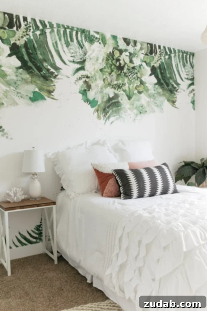 Pre-Teen Style Sanctuary 2 Modern palm removable wallpaper in a beach-themed tween bedroom, featuring a white bed with pink and black and white pillows.