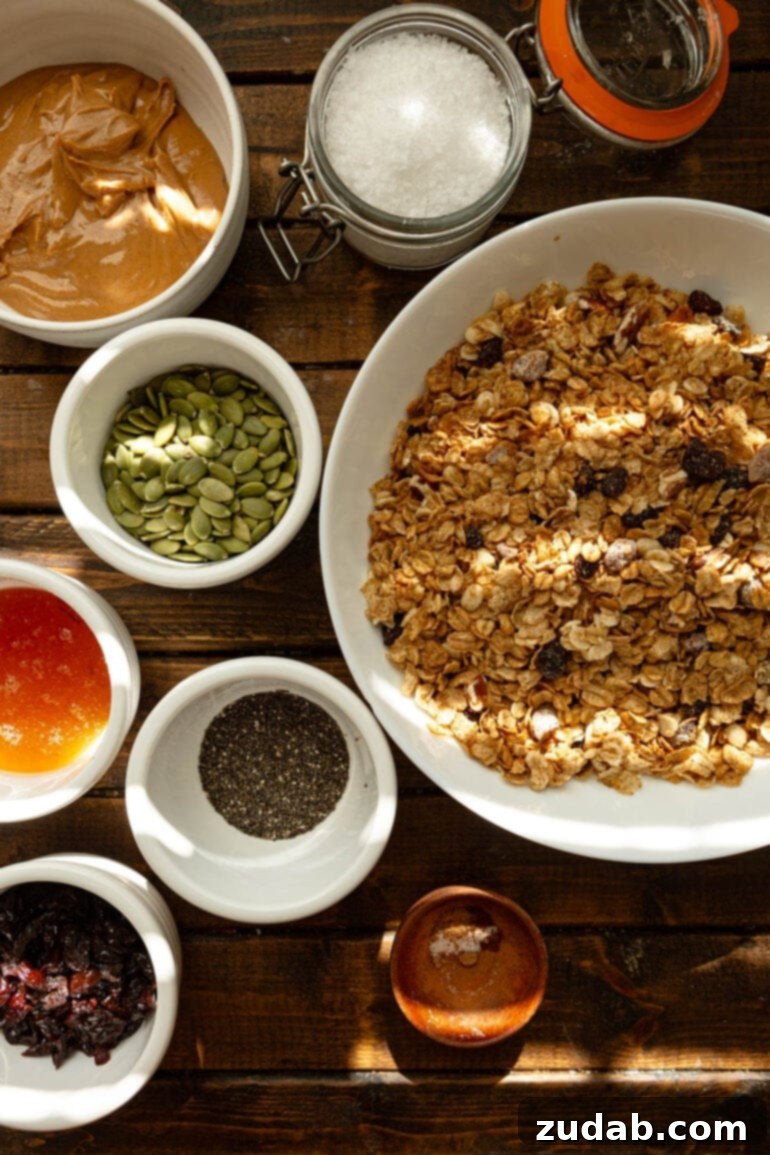 Easy Delicious Cereal Bar Recipe 4 A collection of ingredients for healthy cereal bars laid out in small bowls, including oats, pepitas, honey, and chia seeds, ready for mixing.