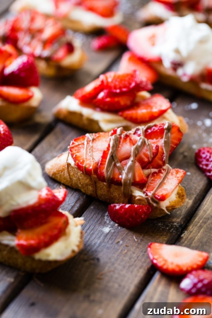 Brown Sugar Kissed Strawberry Crostini 4 A brown board with brown sugar strawberry crostinis and a chocolate drizzle