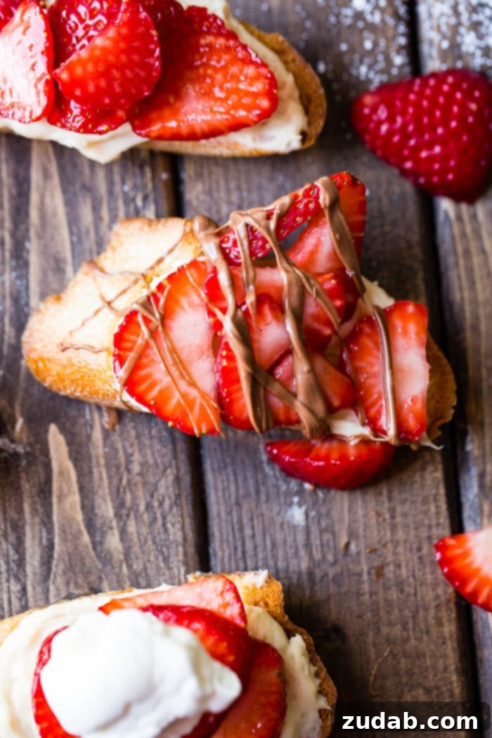 Brown Sugar Kissed Strawberry Crostini 6 A brown board with brown sugar strawberry crostinis and a chocolate drizzle