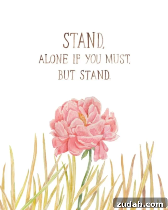 A vibrant pink peony stands tall amidst dry, brittle weeds, illustrating the motto: Stand, alone if you must, but stand, symbolizing courage and conviction.