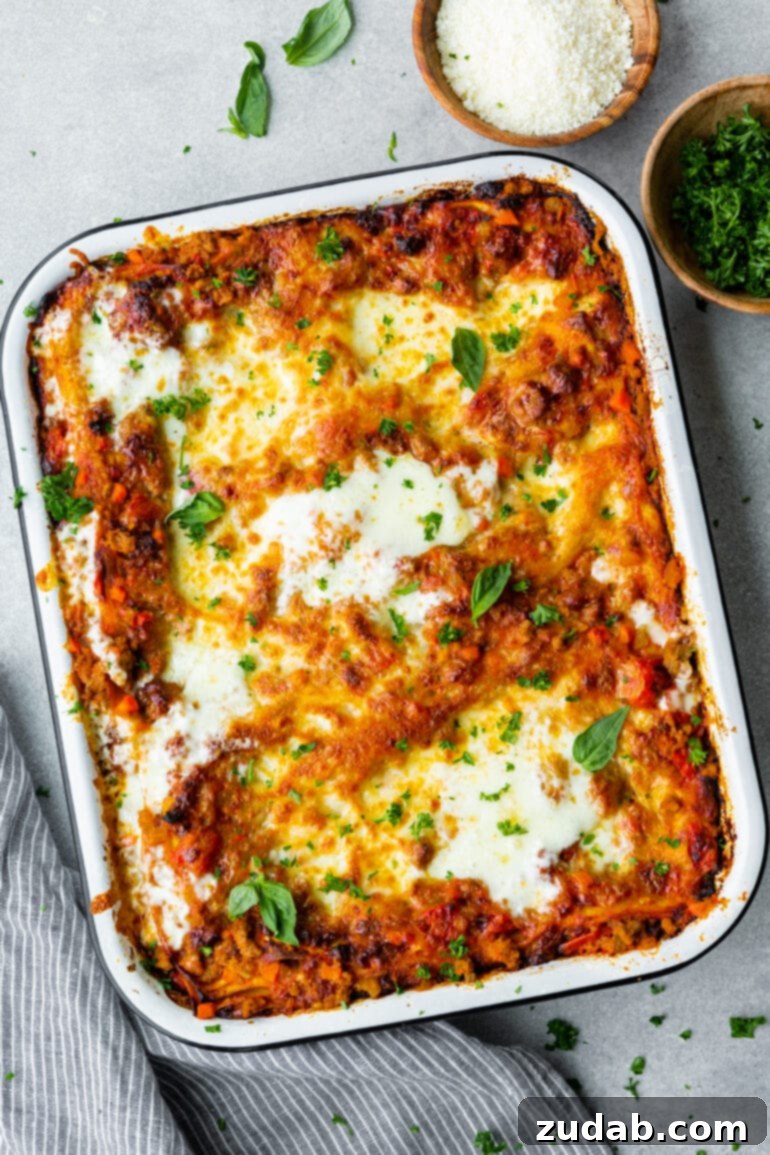 My Go-To Lasagna Masterpiece 5 A full, rectangular baking dish of perfectly baked homemade lasagna, golden brown and bubbling, ready to be served as a hearty, comforting meal.