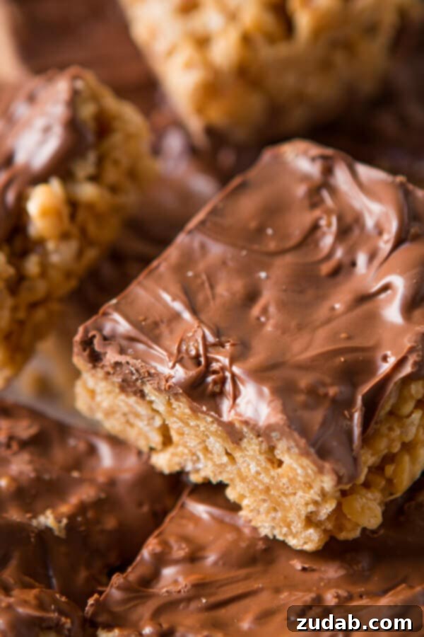 Delicious homemade Scotcheroos with peanut butter, rice krispies, butterscotch chips, and chocolate chips homemade scotcheroos topped with chocolate